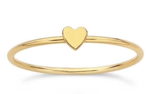 Delicate gold ring with a small heart detail.
